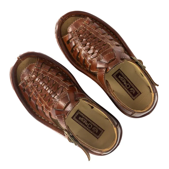 Pair of brown sandals with woven design on a white background