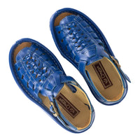 Pair of blue children's sandals on a white background