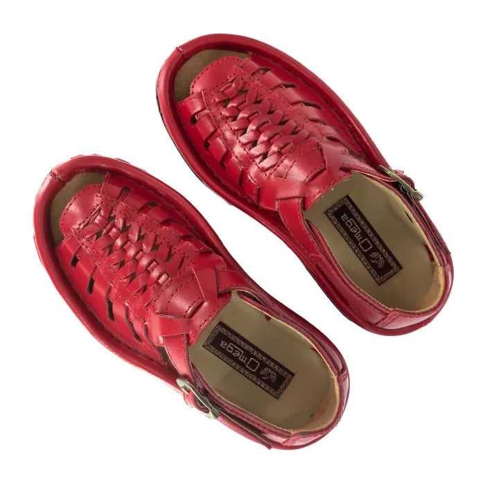 Red sandals with braided design on a white background