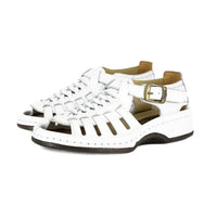 White sandals with brown soles and buckles on a white background