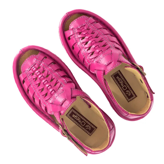 Pair of pink sandals on a white background