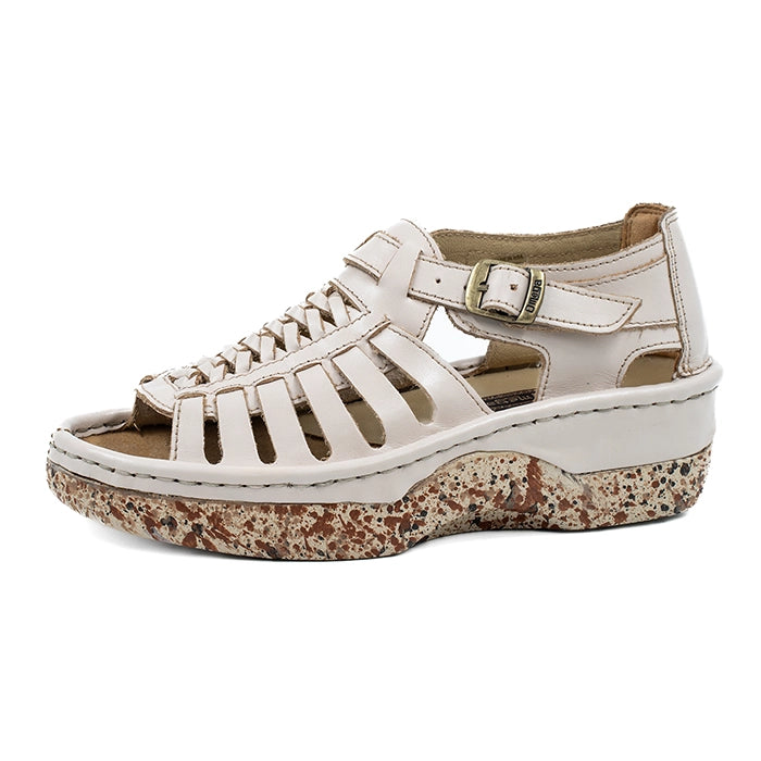 Cream sandal with a patterned sole on a white background