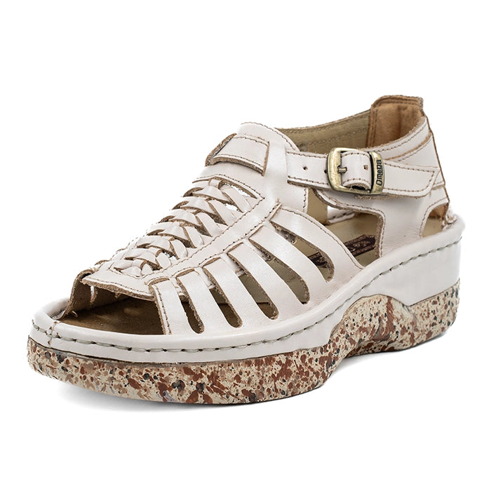 Cream sandal with brown speckled sole on a white background