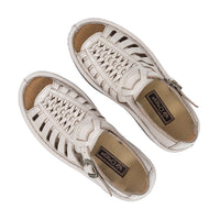 Pair of Cream sandals with cut-out design on a white background