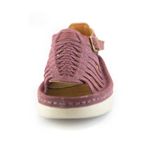 A single lilac suede wedge sandals with cutout straps, a buckle strap, and a beige sole, shown on a white background.