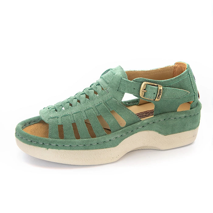 A pair of women's open-toe sandals in a mint suede, featuring cutout straps, a braided front design, adjustable ankle straps with silver buckles, and white soles.