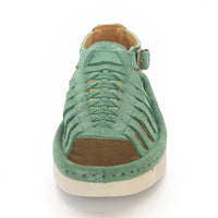 A pair of women's open-toe sandals in a mint suede, featuring cutout straps, a braided front design, adjustable ankle straps with silver buckles, and white soles.