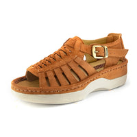 A single peach coloured suede wedge sandals with cutout straps, a buckle strap, and a beige sole, shown on a white background.