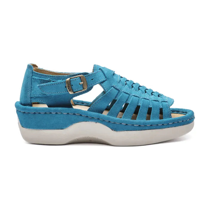 A single women's platform sandal in a vibrant turquoise blue suede, featuring a thick white sole and a silver buckle on the ankle strap, shown against a plain white background.