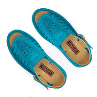 A turquoise blue suede platform sandal with cutout straps, a buckle strap, and a thick cream-colored platform sole, shown from a side profile on a white background.