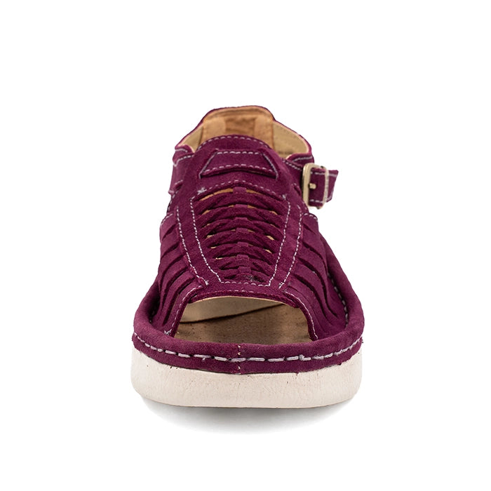 Purple sandal with a off white sole on a white background