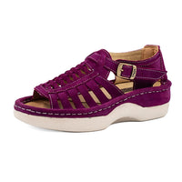 Purple sandal with a white sole on a white background