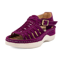 Purple sandal with a white sole on a white background