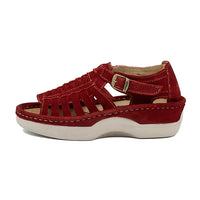 Red sandal with a off white sole on a white background