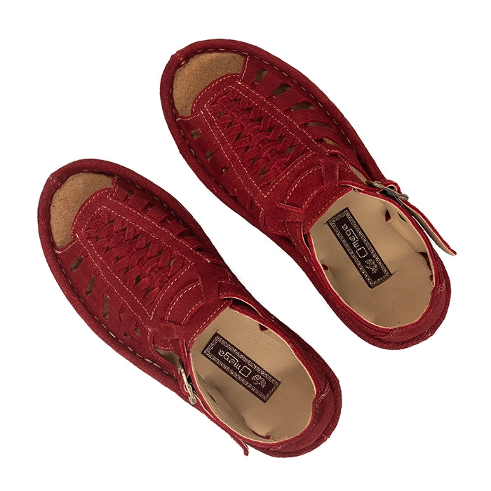 Pair of red sandals with a visible brand label on a white background