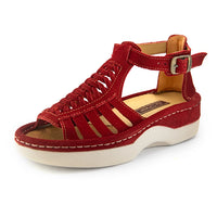 A single red suede wedge sandals with cutout straps, a buckle strap, and a beige sole, shown on a white background.
