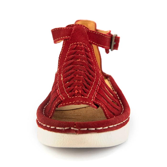 A single red suede wedge sandals with cutout straps, a buckle strap, and a beige sole, shown on a white background.