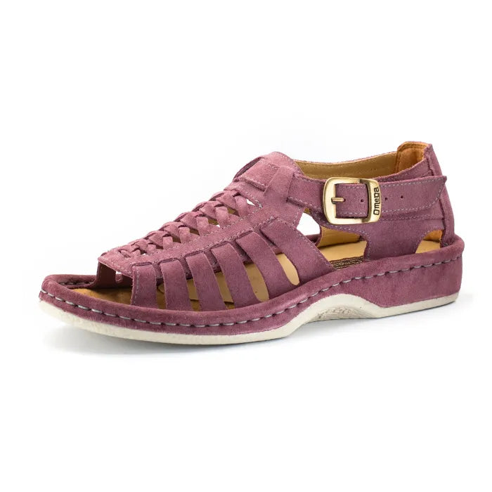 A single shoe with strappy sandals in lilac suede, featuring a cutout design, braided detail across the front, an adjustable ankle strap with a gold-tone buckle, and a low wedge heel. The brand 'Omega' is visible on the buckle.