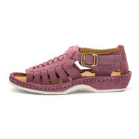 A single shoe with strappy sandals in lilac suede, featuring a cutout design, braided detail across the front, an adjustable ankle strap with a gold-tone buckle, and a low wedge heel. The brand 'Omega' is visible on the buckle.