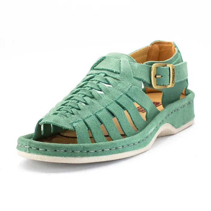 A mint green suede wedge sandal with cutout straps, an adjustable ankle strap with a gold buckle, and a tan interior, shown on a white background.