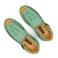 A pair of mint green woven leather sandals with tan insoles and brown brand labels, photographed from a top-down angle on a white background.