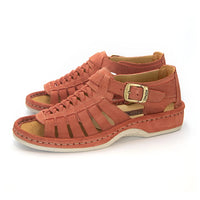 A pair of mango coloured suede sandals with cutout straps, braided detailing, and adjustable ankle buckles, shown on a white background.