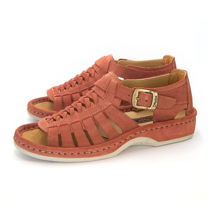 A pair of mango coloured suede sandals with cutout straps, braided detailing, and adjustable ankle buckles, shown on a white background.