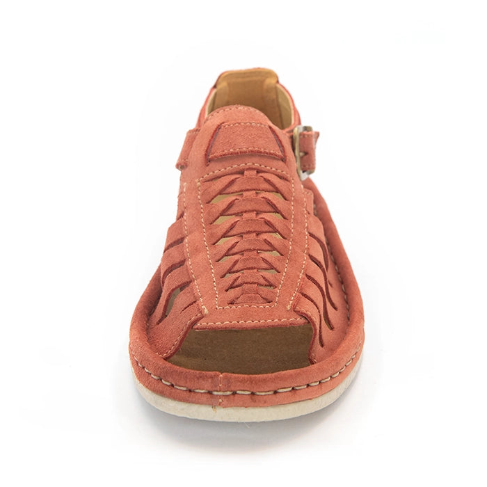 A single mango coloured suede sandals with cutout straps, braided detailing, and adjustable ankle buckles, shown on a white background.