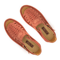 A pair of mango coloured suede sandals with cutout straps, braided detailing, and adjustable ankle buckles, shown on a white background.