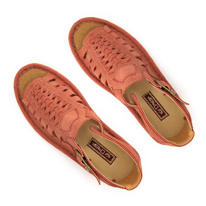 A pair of mango coloured suede sandals with cutout straps, braided detailing, and adjustable ankle buckles, shown on a white background.