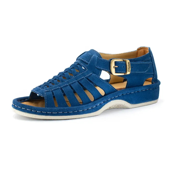 A single sandal in royal blue suede, featuring a multi-cut strap design, an adjustable ankle strap with a gold-tone buckle, and a thick white sole.