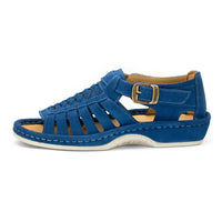 A single sandal in royal blue suede, featuring a multi-cut strap design, an adjustable ankle strap with a gold-tone buckle, and a thick white sole.