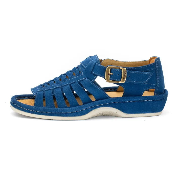A single sandal in royal blue suede, featuring a multi-cut strap design, an adjustable ankle strap with a gold-tone buckle, and a thick white sole.
