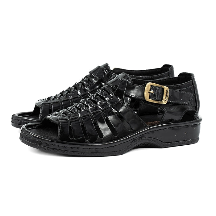 Black sandals with a gold buckle on a white background