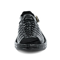 Black sandal with a strap on a white background