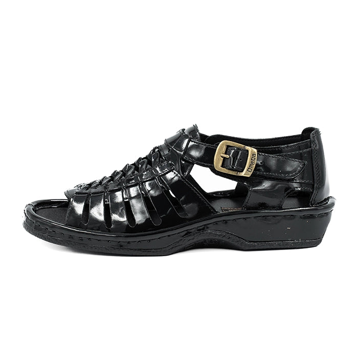 Black sandal with a gold buckle on a white background