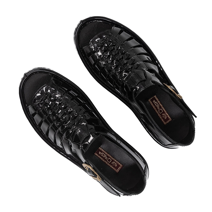 Pair of black sandals on a white background