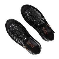 Pair of black sandals on a white background