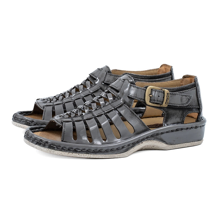 Pair of grey sandals with a buckle on a white background