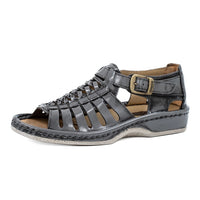 Grey sandal with a buckle on a white background