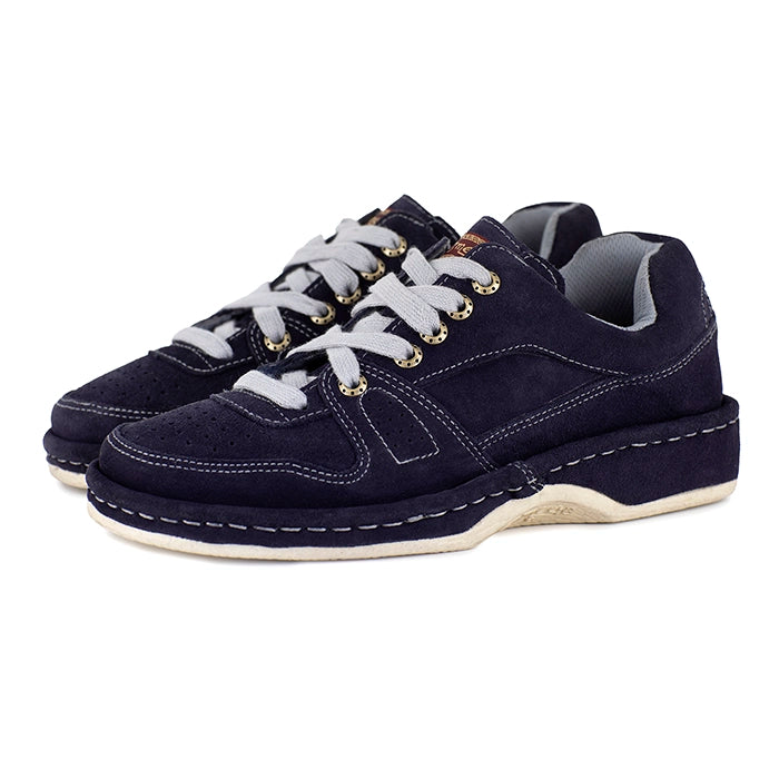Pair of navy blue sneakers with grey laces on a white background