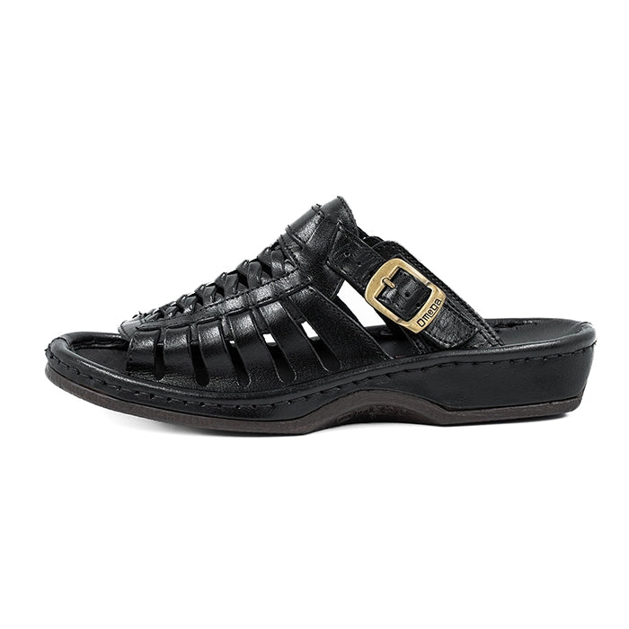Black sandal with a gold buckle on a white background