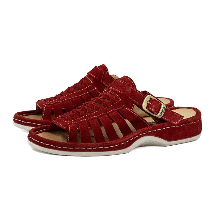 Red sandals with a buckle on a white background