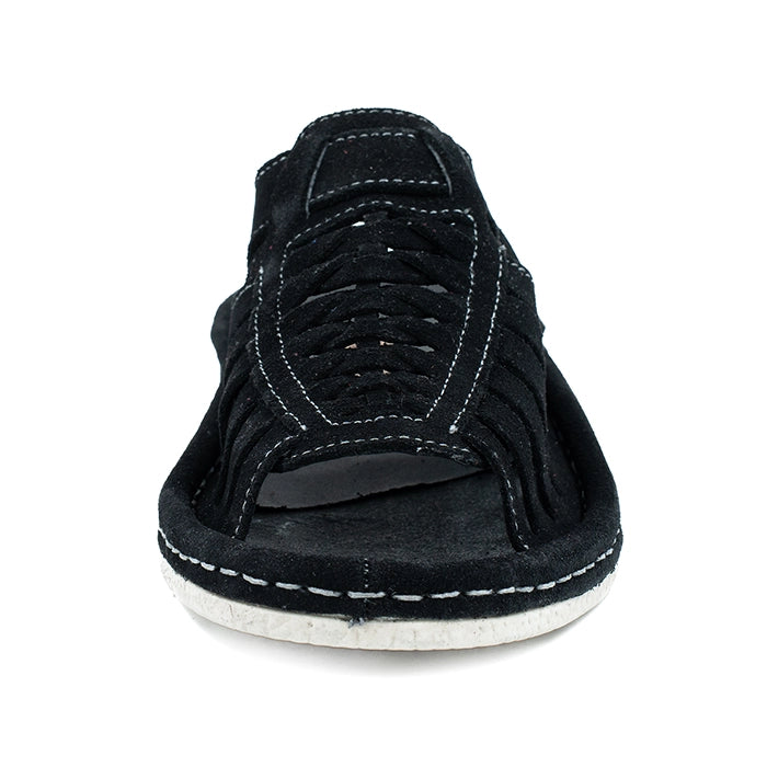 Black sandal with off white sole on a white background