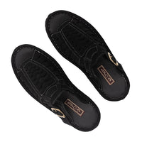 Pair of black slip-on shoes with brand logo on a white background