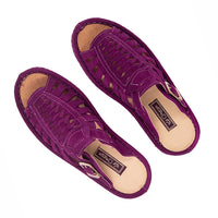 Pair of purple sandals on a white background