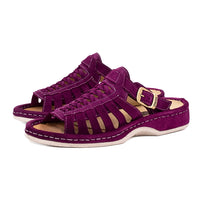 Purple sandals with a buckle on a white background