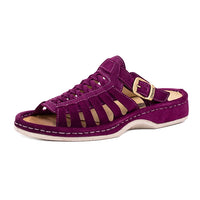 Purple sandal with a white sole on a white background