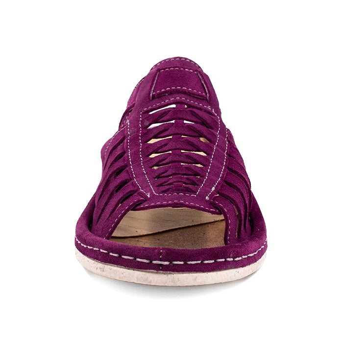 Purple sandal with cut-out design on a white background
