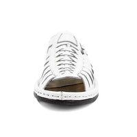 White sandal with brown insole on a white background